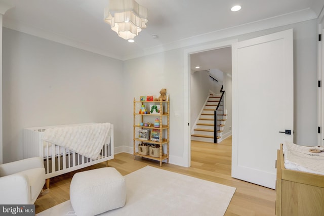 7013 Raleigh Rd, Annandale, VA 22003 - bedroom with a nursery area, light wood-style floors, baseboards, a notable chandelier, and recessed lighting