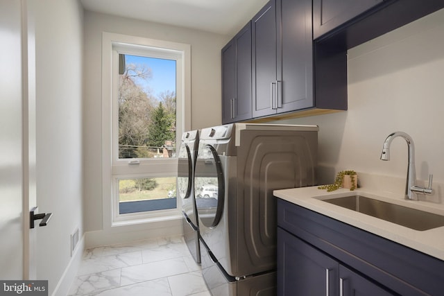 7013 Raleigh Rd, Annandale, VA 22003 - laundry area featuring a sink, separate washer and dryer, marble finish floor, cabinet space, and visible vents