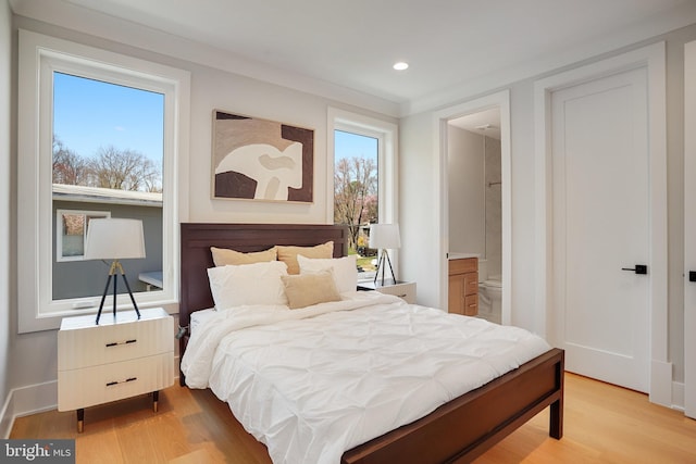 7013 Raleigh Rd, Annandale, VA 22003 - bedroom with connected bathroom, baseboards, recessed lighting, and light wood-style flooring