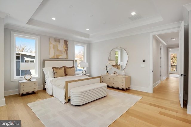 7013 Raleigh Rd, Annandale, VA 22003 - bedroom with light wood finished floors, a raised ceiling, and multiple windows