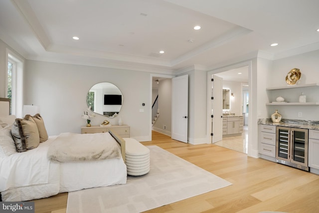 7013 Raleigh Rd, Annandale, VA 22003 - bedroom featuring a tray ceiling, light wood-style flooring, recessed lighting, and wine cooler