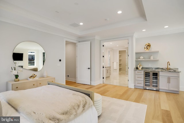 7013 Raleigh Rd, Annandale, VA 22003 - bedroom featuring recessed lighting, beverage cooler, light wood finished floors, a sink, and indoor wet bar