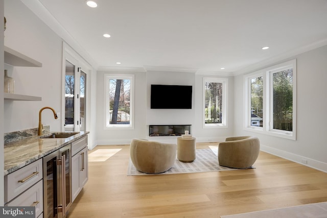 7013 Raleigh Rd, Annandale, VA 22003 - living area featuring light wood finished floors, indoor wet bar, beverage cooler, and recessed lighting