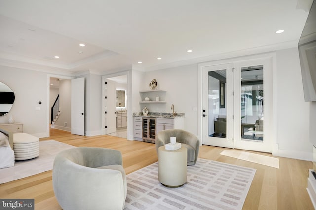 7013 Raleigh Rd, Annandale, VA 22003 - living area featuring recessed lighting, light wood finished floors, wine cooler, a raised ceiling, and indoor wet bar