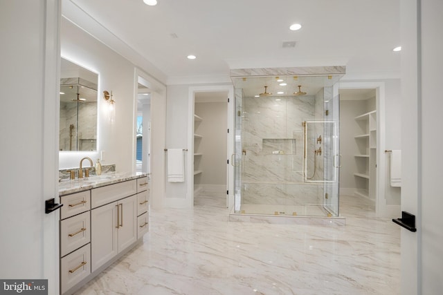 7013 Raleigh Rd, Annandale, VA 22003 - bathroom featuring a spacious closet, marble finish floor, vanity, and a marble finish shower