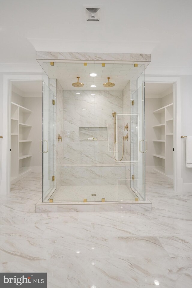 7013 Raleigh Rd, Annandale, VA 22003 - bathroom with a spacious closet, marble finish floor, a marble finish shower, and visible vents