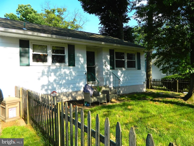 view of front of home with a front yard