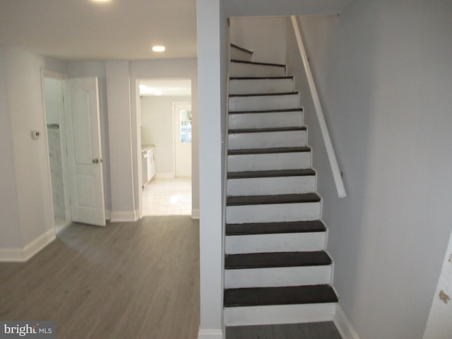 unfurnished room featuring plenty of natural light and dark hardwood / wood-style flooring