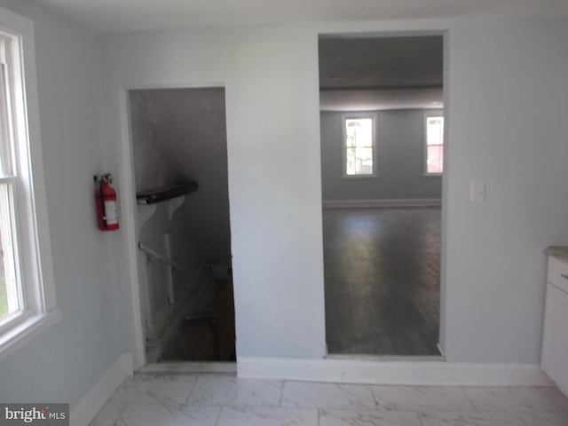 bathroom featuring backsplash, a bathtub, tile walls, and vanity