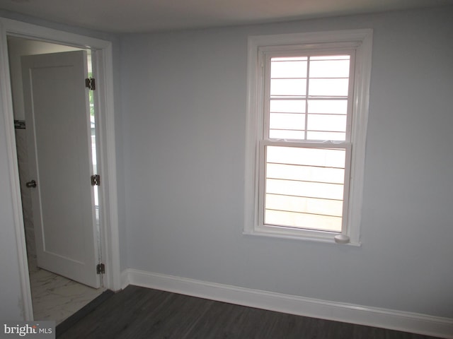 empty room featuring dark hardwood / wood-style floors