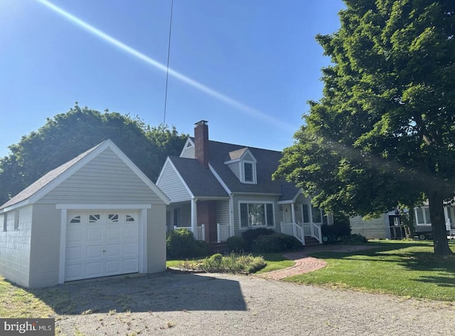 view of front of property featuring a front yard and a garage