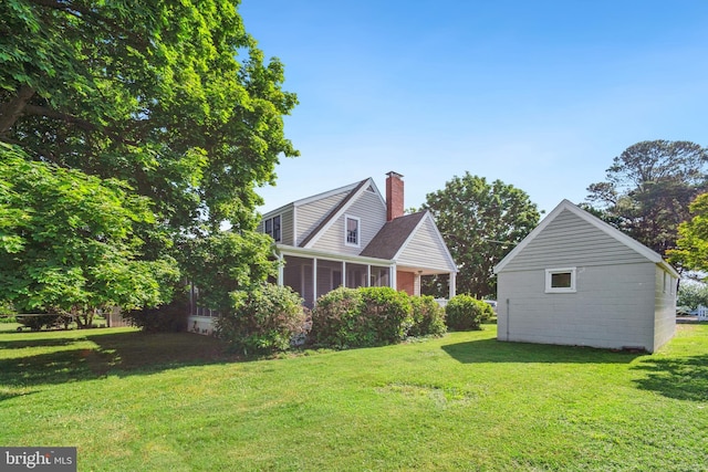 view of yard featuring a sunroom