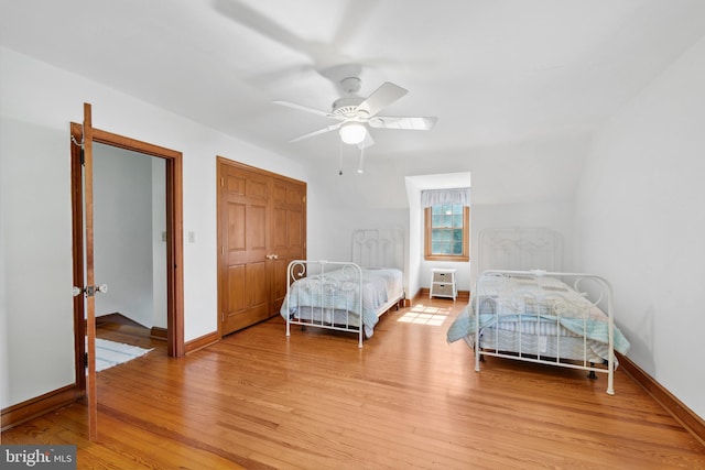 bedroom featuring ceiling fan and light hardwood / wood-style flooring