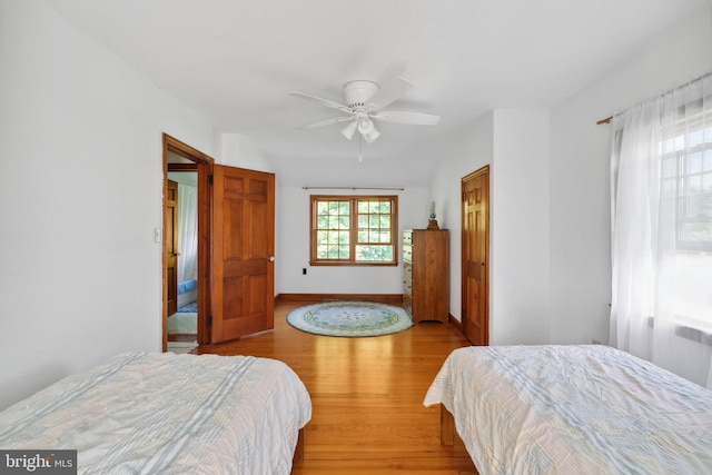 bedroom featuring light wood-type flooring and ceiling fan