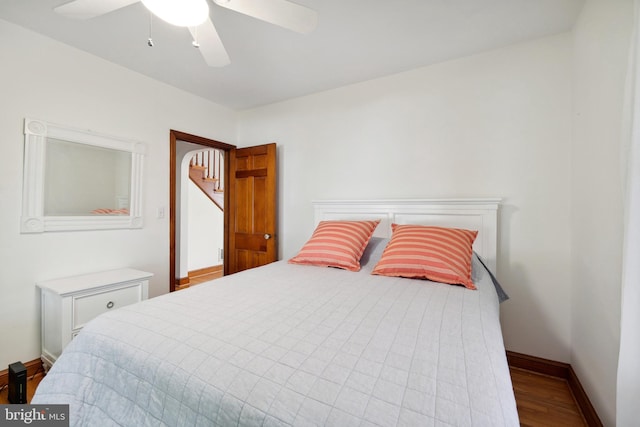 bedroom featuring ceiling fan and hardwood / wood-style flooring