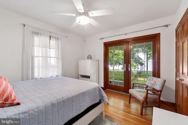 bedroom with access to outside, ceiling fan, french doors, and wood-type flooring