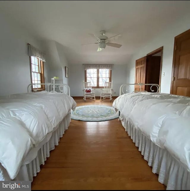 bedroom featuring ceiling fan and hardwood / wood-style floors