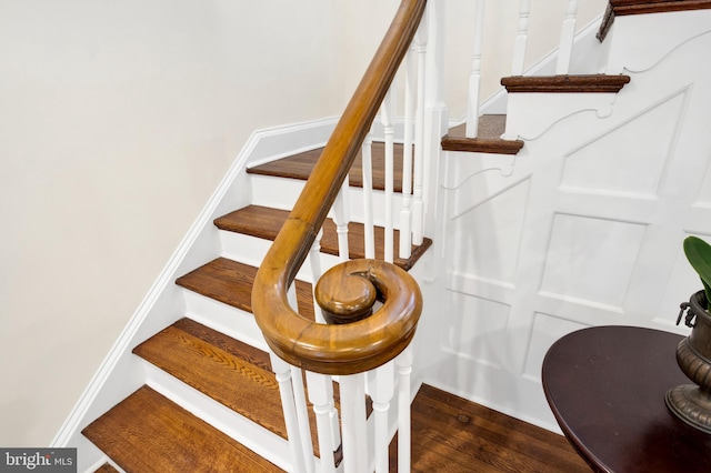 staircase featuring hardwood / wood-style flooring