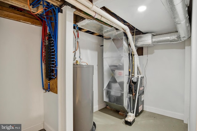 utility room with heating unit and water heater