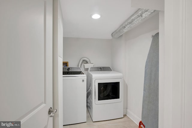 laundry area with washing machine and clothes dryer