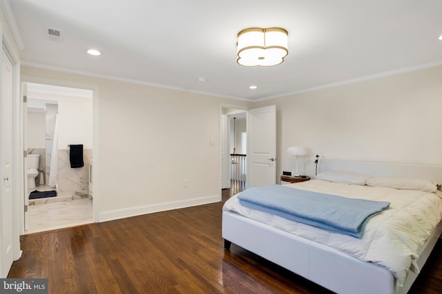 bedroom featuring ensuite bathroom, dark hardwood / wood-style floors, and ornamental molding