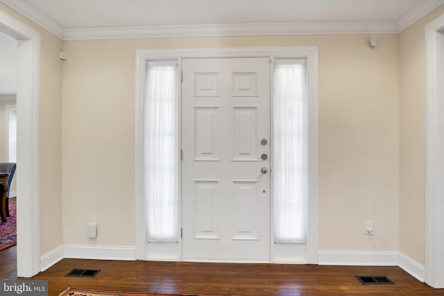 foyer with a healthy amount of sunlight, wood-type flooring, and ornamental molding