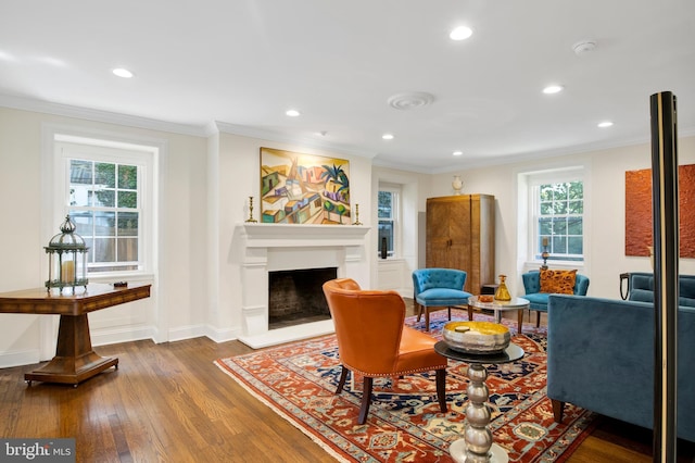 living room with ornamental molding and dark wood-type flooring