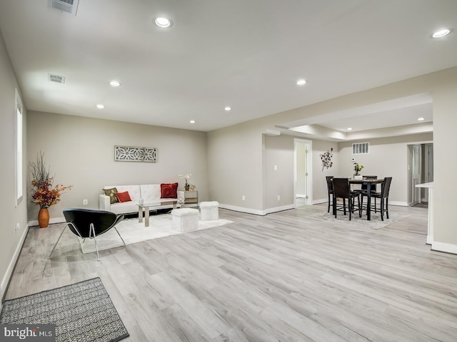 living room with light hardwood / wood-style flooring