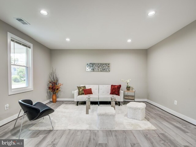 sitting room with light hardwood / wood-style flooring