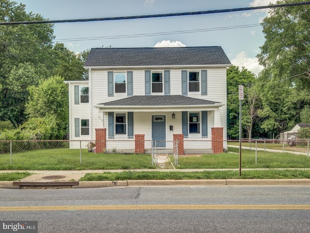 view of front of home featuring a front yard and covered porch