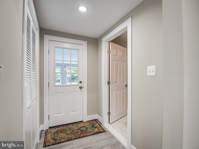 doorway to outside with light hardwood / wood-style flooring