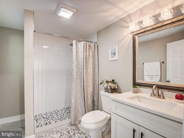 bathroom with toilet, vanity, and a shower with curtain