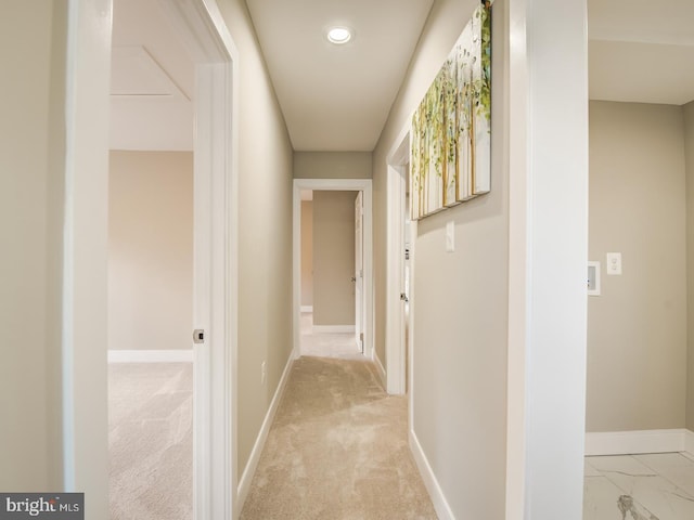 hallway with light colored carpet