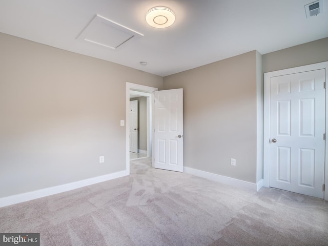 unfurnished bedroom with light colored carpet