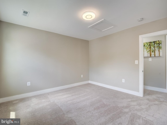 empty room with light colored carpet