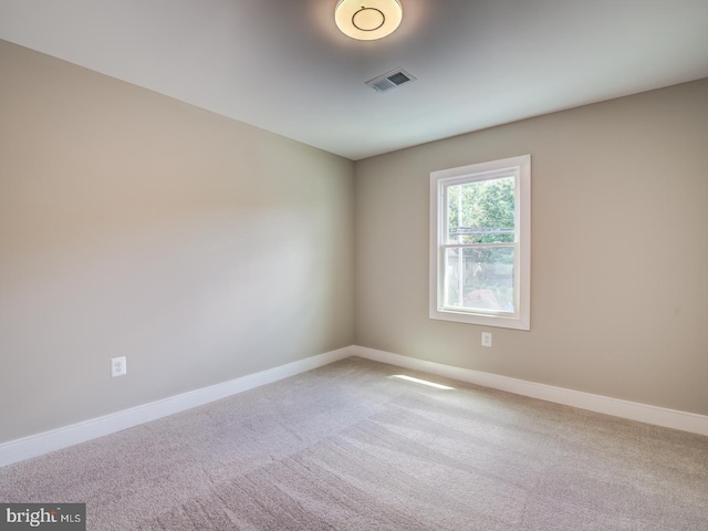 spare room featuring carpet flooring