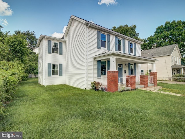 view of front of house featuring a front lawn and a porch