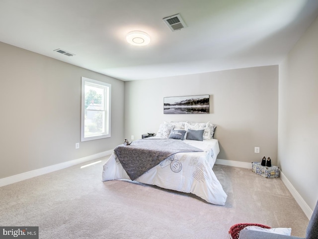 bedroom with light colored carpet