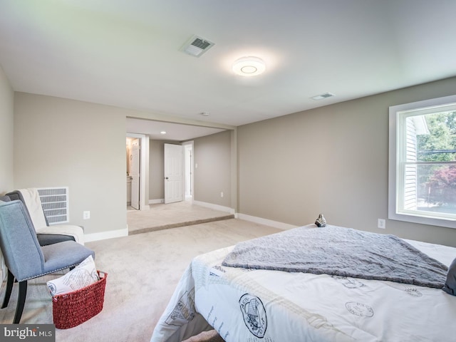 bedroom featuring light carpet