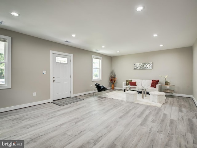 unfurnished living room with light wood-type flooring