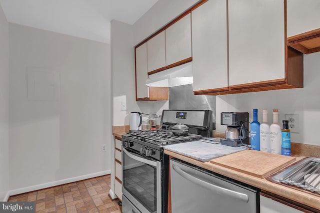 kitchen featuring white cabinets and appliances with stainless steel finishes