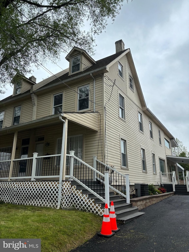 exterior space featuring a porch and central AC unit