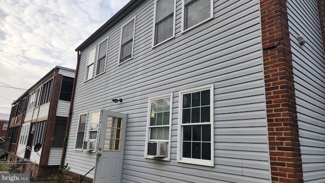 view of side of property featuring cooling unit