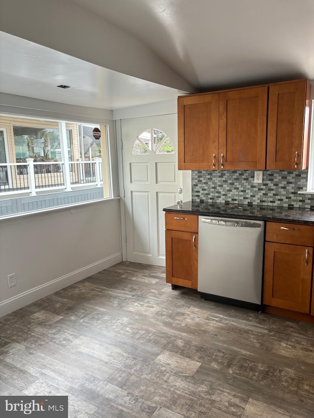 kitchen with decorative backsplash and stainless steel dishwasher