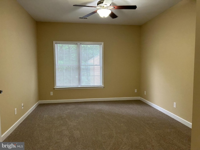 spare room with ceiling fan and carpet floors