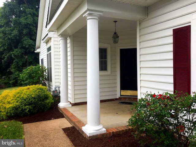 doorway to property with a porch