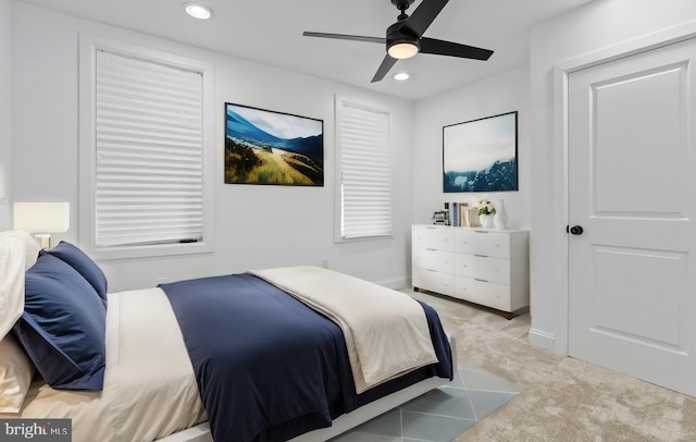 bedroom featuring ceiling fan and light colored carpet