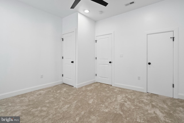 unfurnished bedroom featuring carpet flooring and ceiling fan