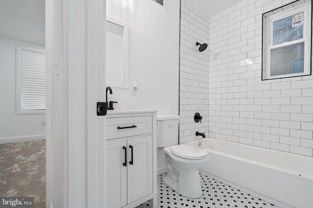 full bathroom featuring vanity, toilet, and tiled shower / bath