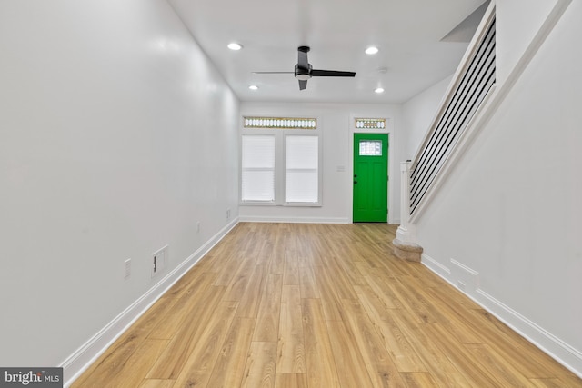 entryway with ceiling fan and light hardwood / wood-style flooring